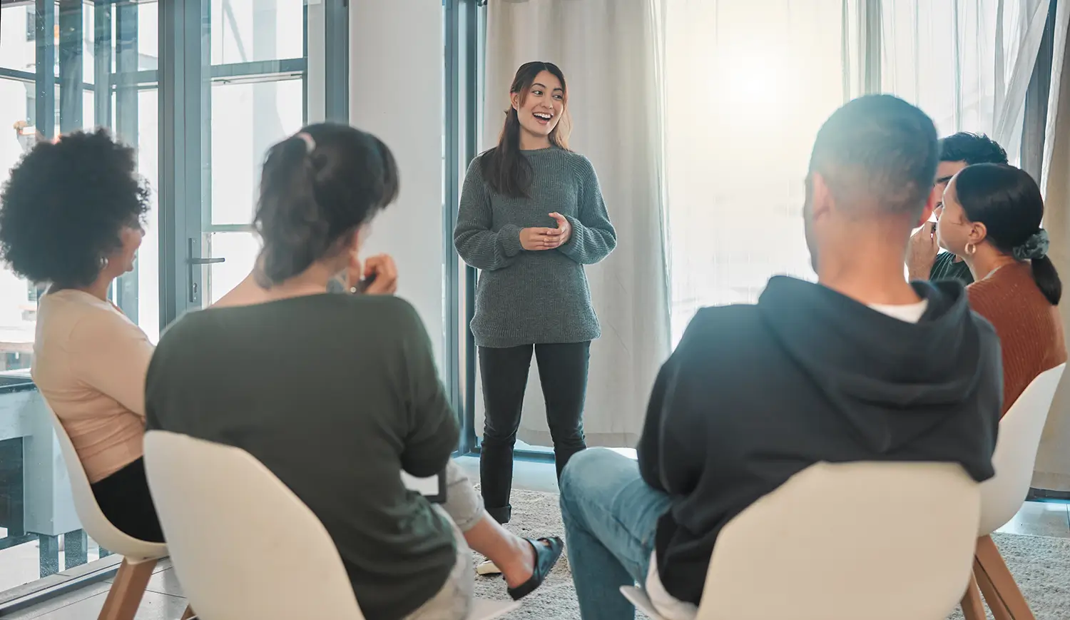 Women talking about therapy sessions in a group